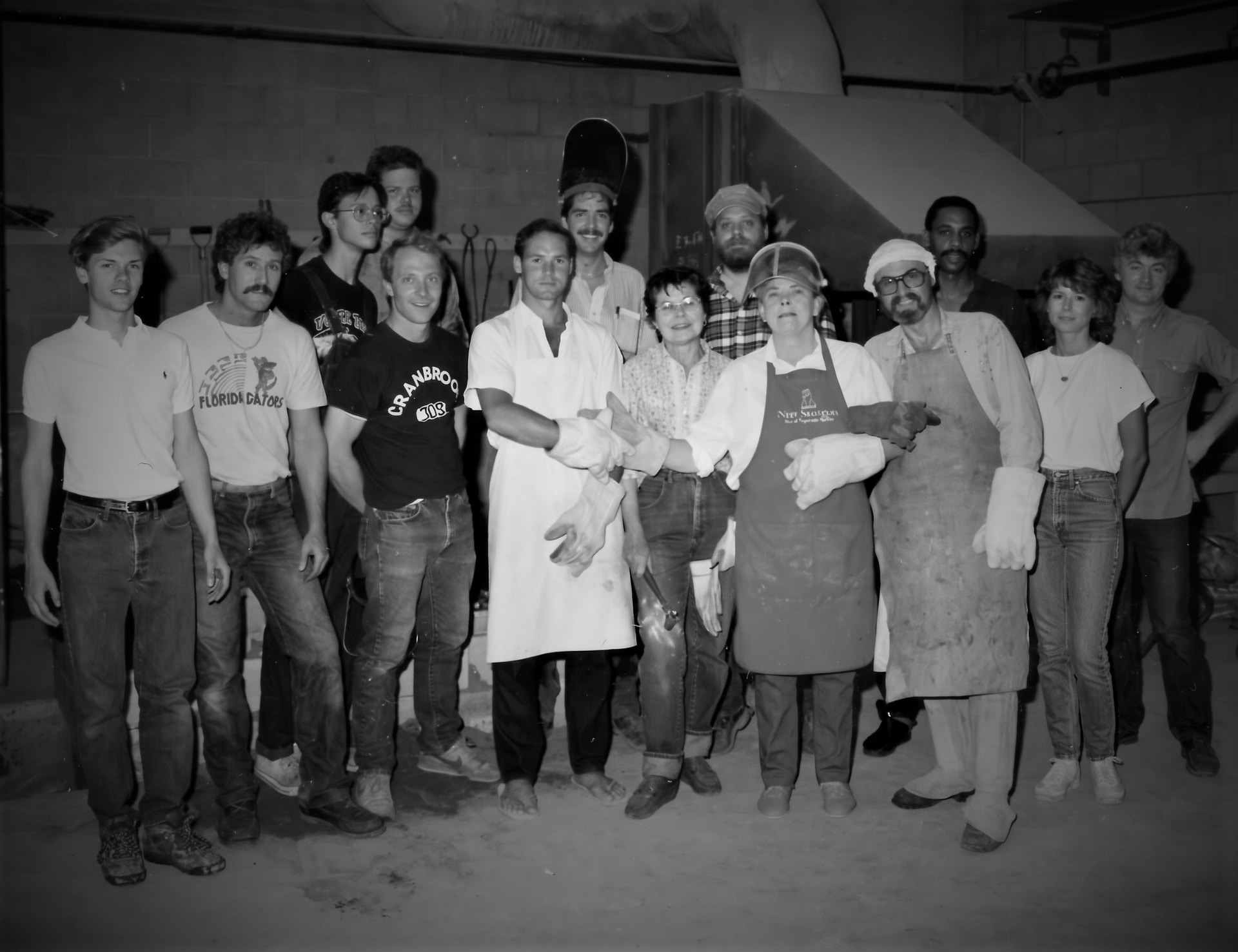The workshop team gathered around the foundry pour floor