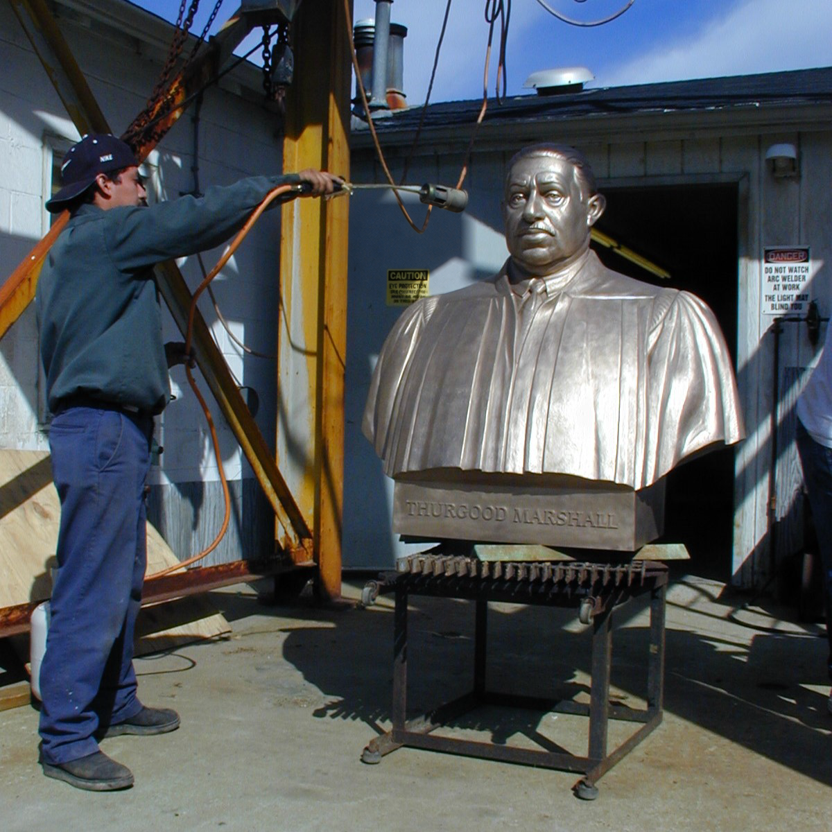 Finishing the bronze Thurgood Marshall bust at the foundry